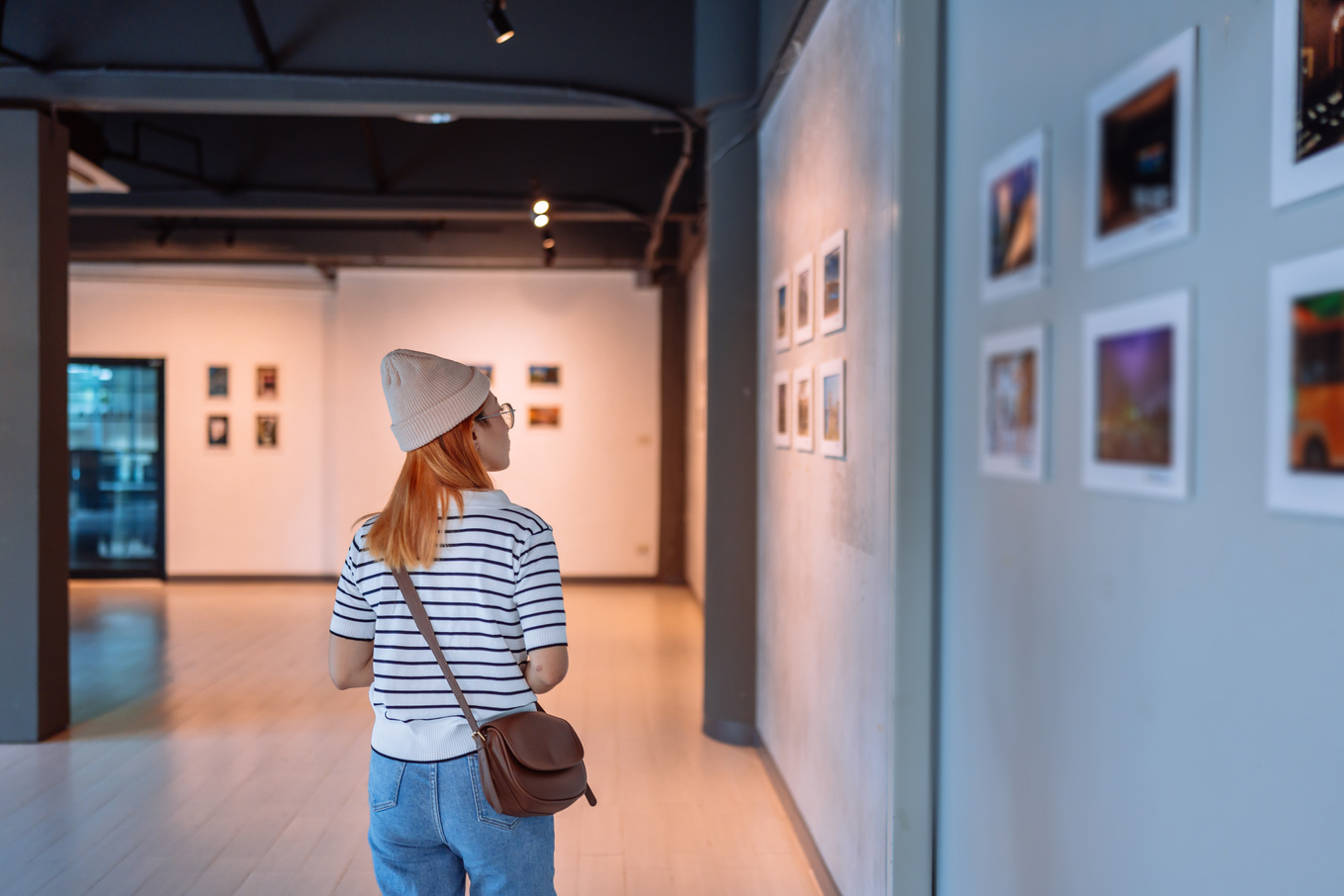 Woman looking photo in art gallery
